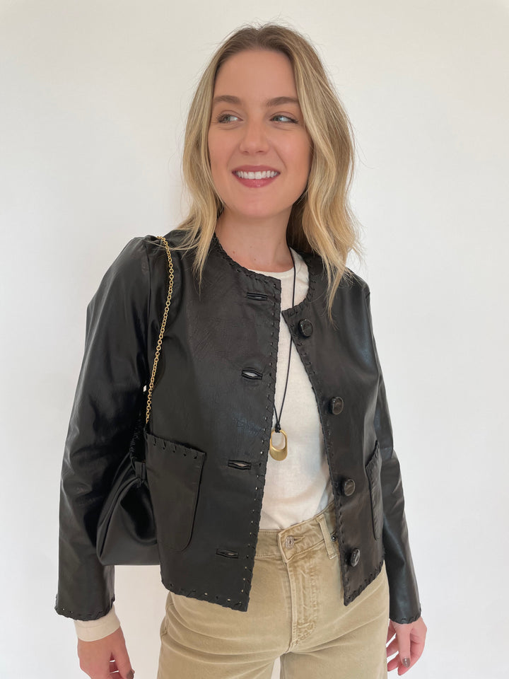 Cinq a Sept Nevina Leather Jacket in Black paired with Citizens of humanity Lyra Crop Wide Leg Jeans in Porcini, Dean Davidson Crosby Long Pendant Necklace in Gold,  DeMellier Miami Clutch in Black available at Barbara Katz