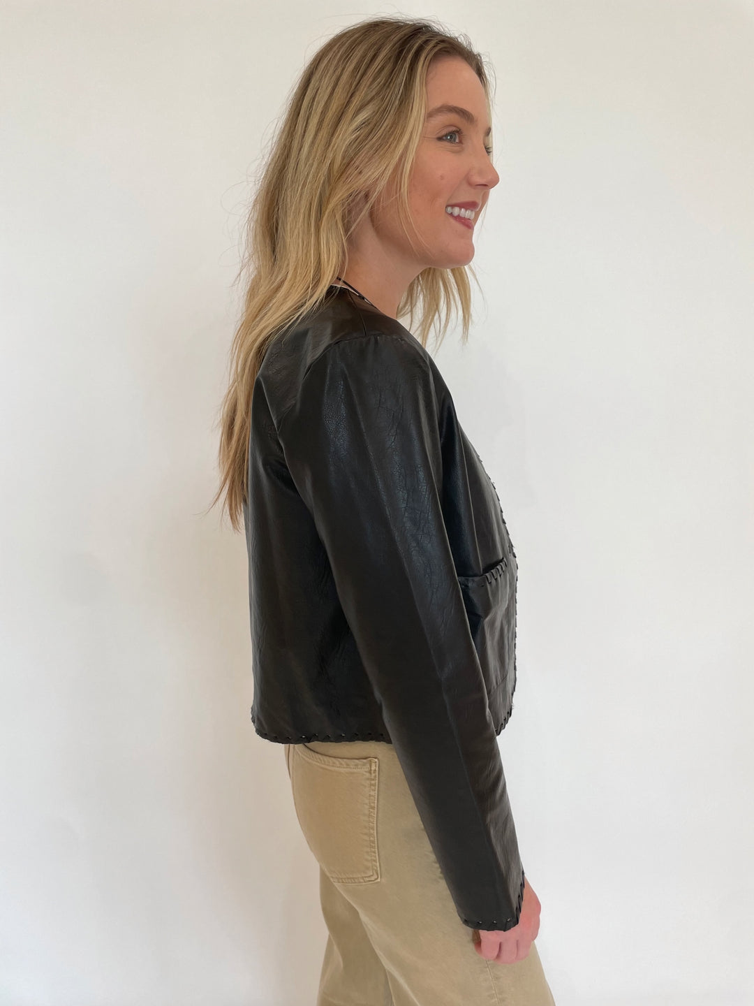 Cinq a Sept Nevina Long Sleeve Vegan Leather Jacket in Black paired with Citizens of humanity Lyra Crop Wide Leg Jeans in Porcini available at Barbara Katz