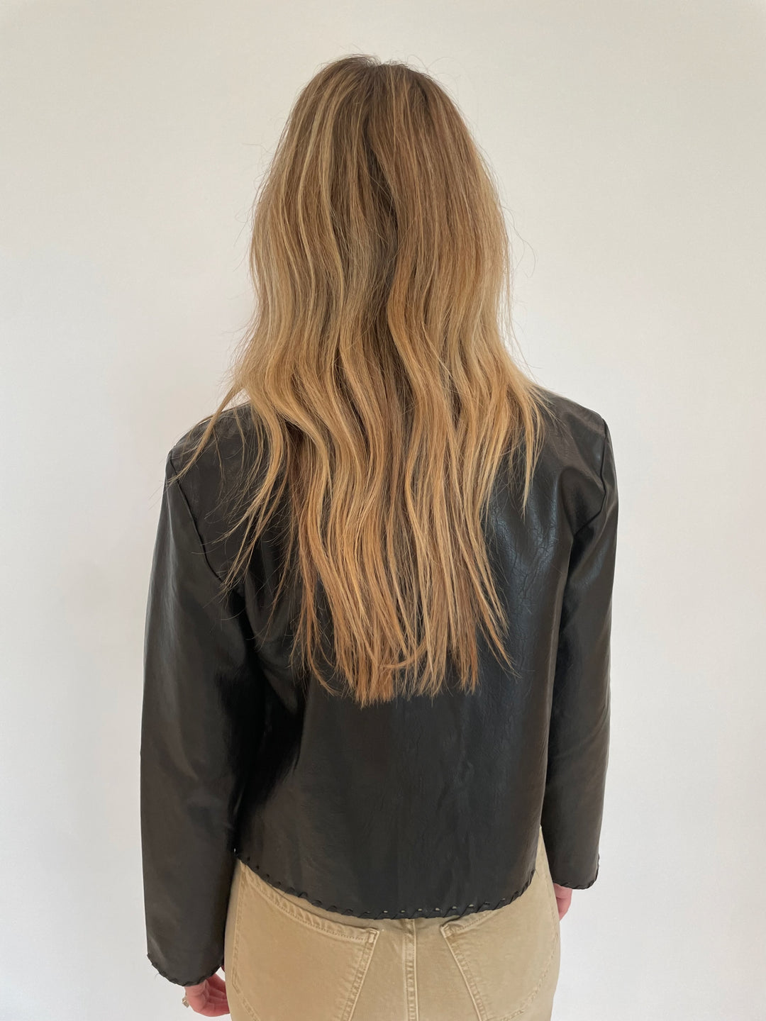 Cinq a Sept Nevina Faux Leather Jacket in Black paired with Citizens of humanity Lyra Crop Wide Leg Jeans in Porcini available at Barbara Katz