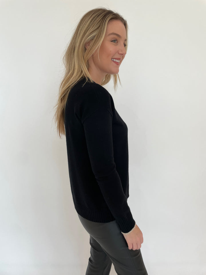 Lisa Todd Love Front Long Sleeve Sweater in Black paired with Elliott Lauren Black Coated Bengaline Pants available at Barbara Katz