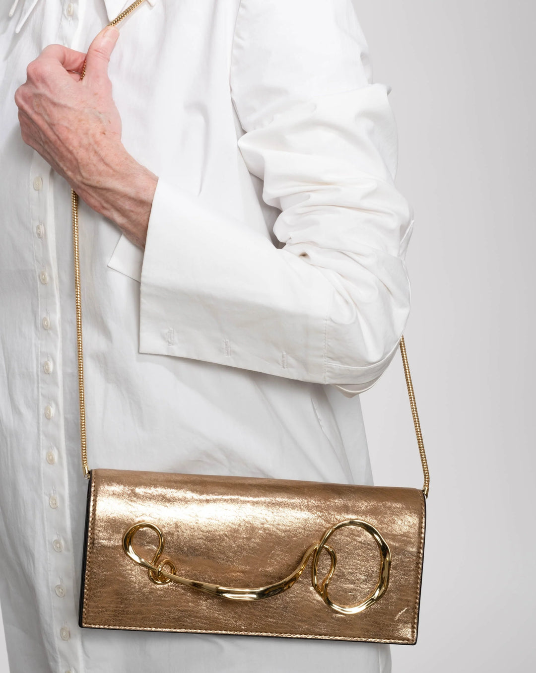 Alexis Bittar Twisted Gold Side Handle Clutch Crossbody Bag in Antique Gold available at Barbara Katz