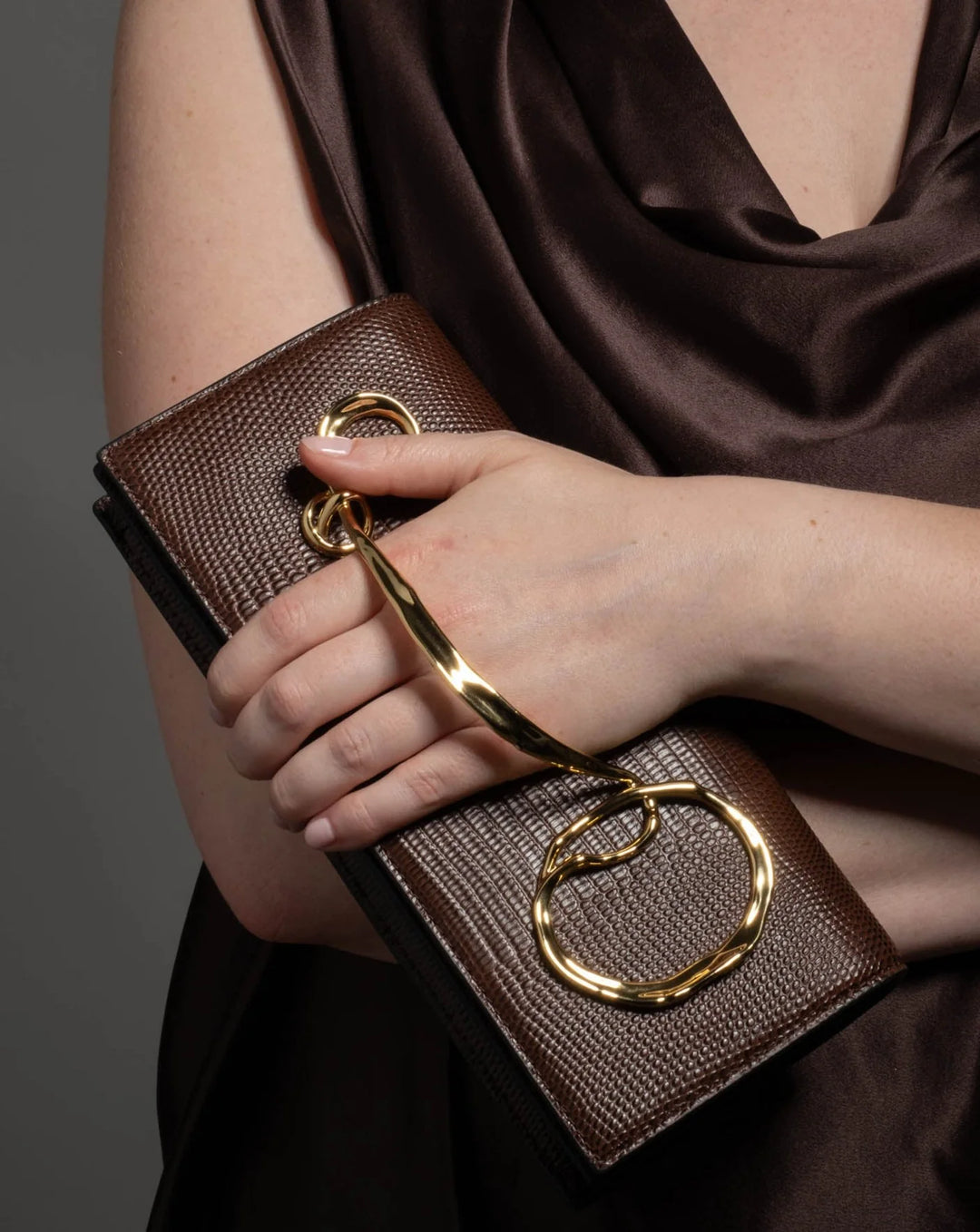 Alexis Bittar Twisted Gold Side Handle Clutch Bag in Chocolate available at Barbara Katz