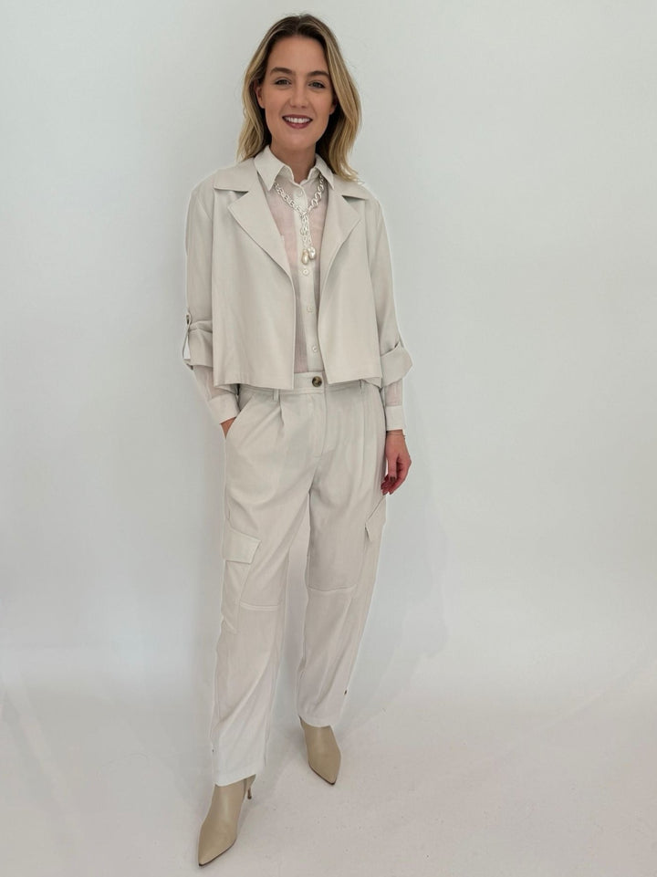 Marella Monochrome Vento Crop Jacket in Wool White with Orzo Sheer Blouse underneath, paired with Alisso Cargo Pants, Lizzie Fortunato Edith Lariat Necklace - all available at Barbara Katz 