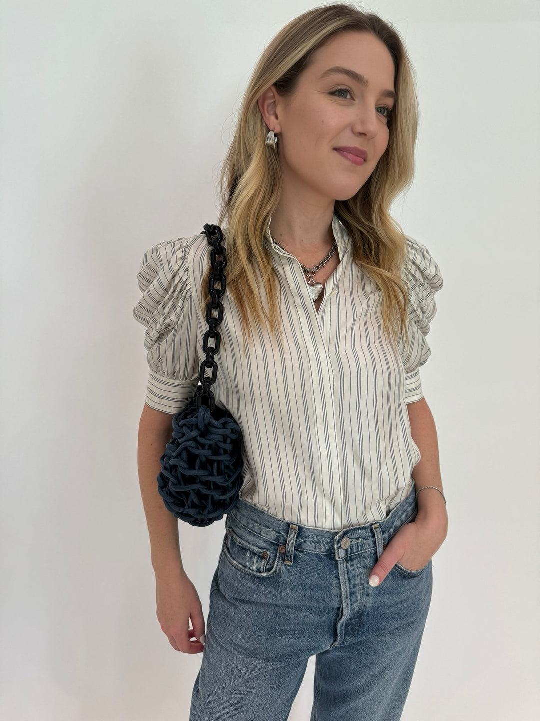 Frame Gillian Top in Cream Multi paired with Agolde Fran Jeans and Alienina Mina Small Bag in Blue Waxed + Black Chain