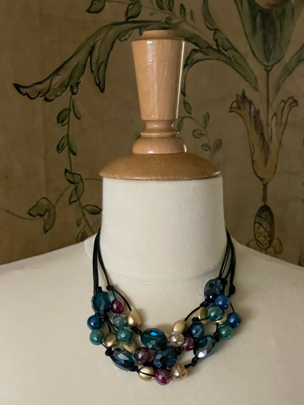 Deborah Grivas Multi Glazed Agate With Teal Crystal Torsade Necklace on Black Linen and Leather