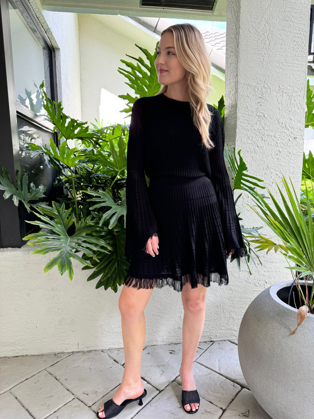 Maria Pavan Miley Fringe Long Sleeve Top paired with Riley Fringe Skirt in Black available at Barbara Katz