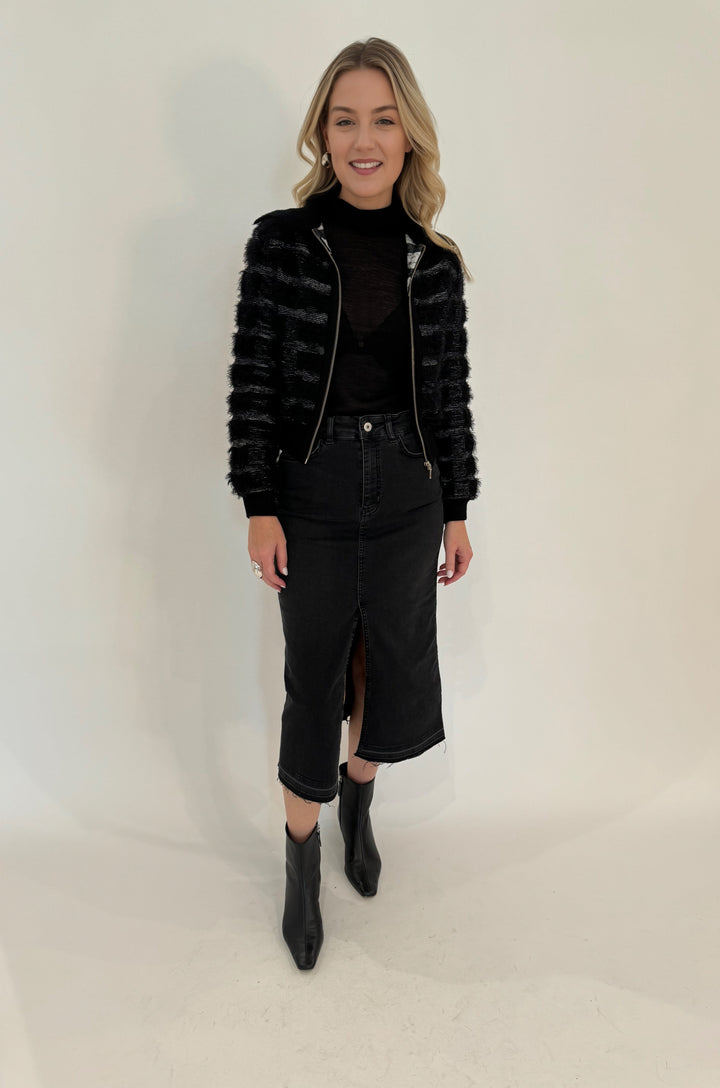 Elliott Lauren Geneva Jean Skirt With Front Slit in Black paired with Maria Pavan Fringe Check Zip Up Sweater available at Barbara Katz