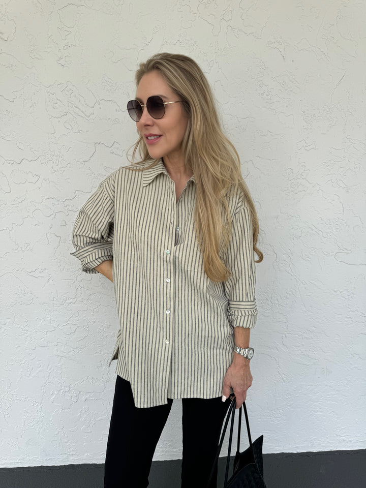 Donni The Linen Stripe Relaxed Shirt in Stone Stripe, made from linen cotton fabric, featuring a point collar, button front closures, long sleeves, chest pocket, and stripes pattern