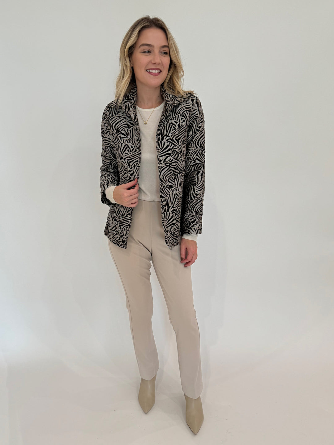 Caroline Rose Exotic Elegance Jacket in Multi/Black paired with Peace of Cloth Annie Paramount Knit Pants in Buff available at Barbara Katz