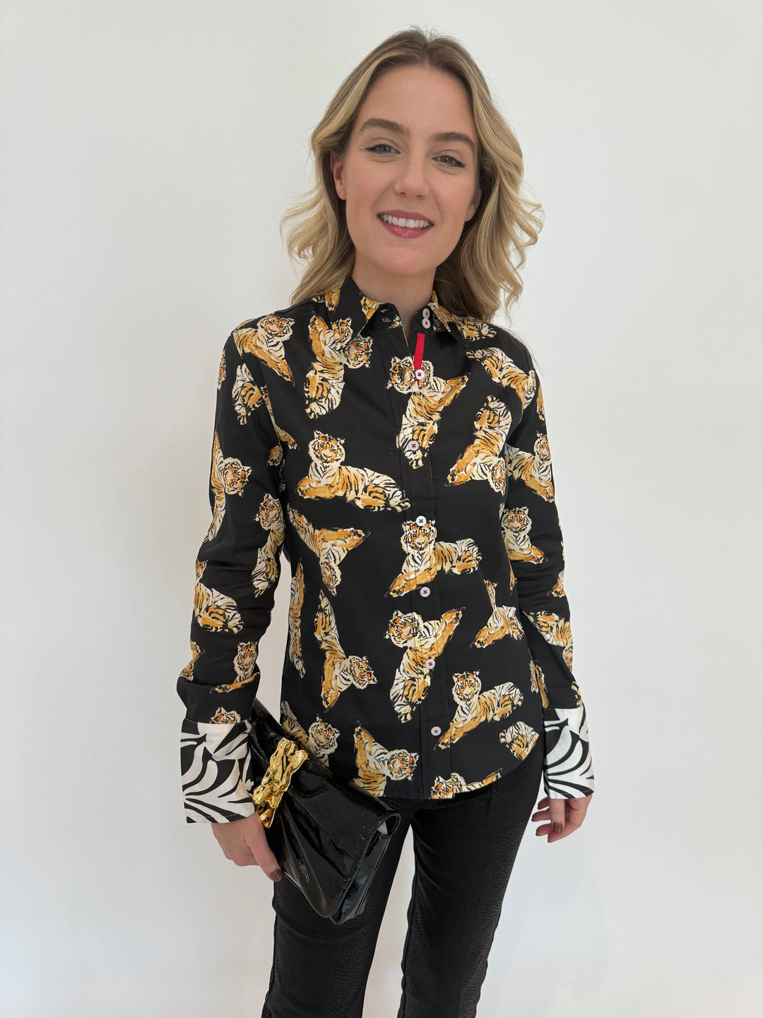 Dizzy-Lizzie Rome Long Sleeve Shirt in Black With Tiger Print, Alexis Bittar Gold Ribbon Convertible Shoulder Bag in Black available at Barbara Katz