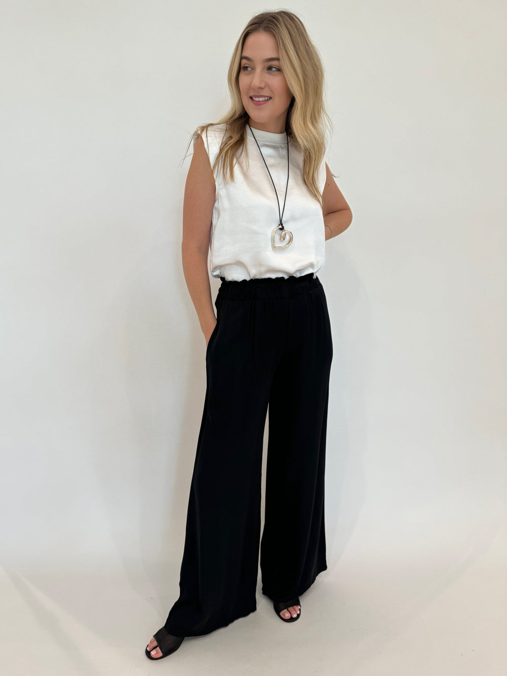 Melissa Nepton Helero Satin Top in Off White paired with BK Sophie Italian Silky Viscose Palazzo Pants in Black available at Barbara Katz