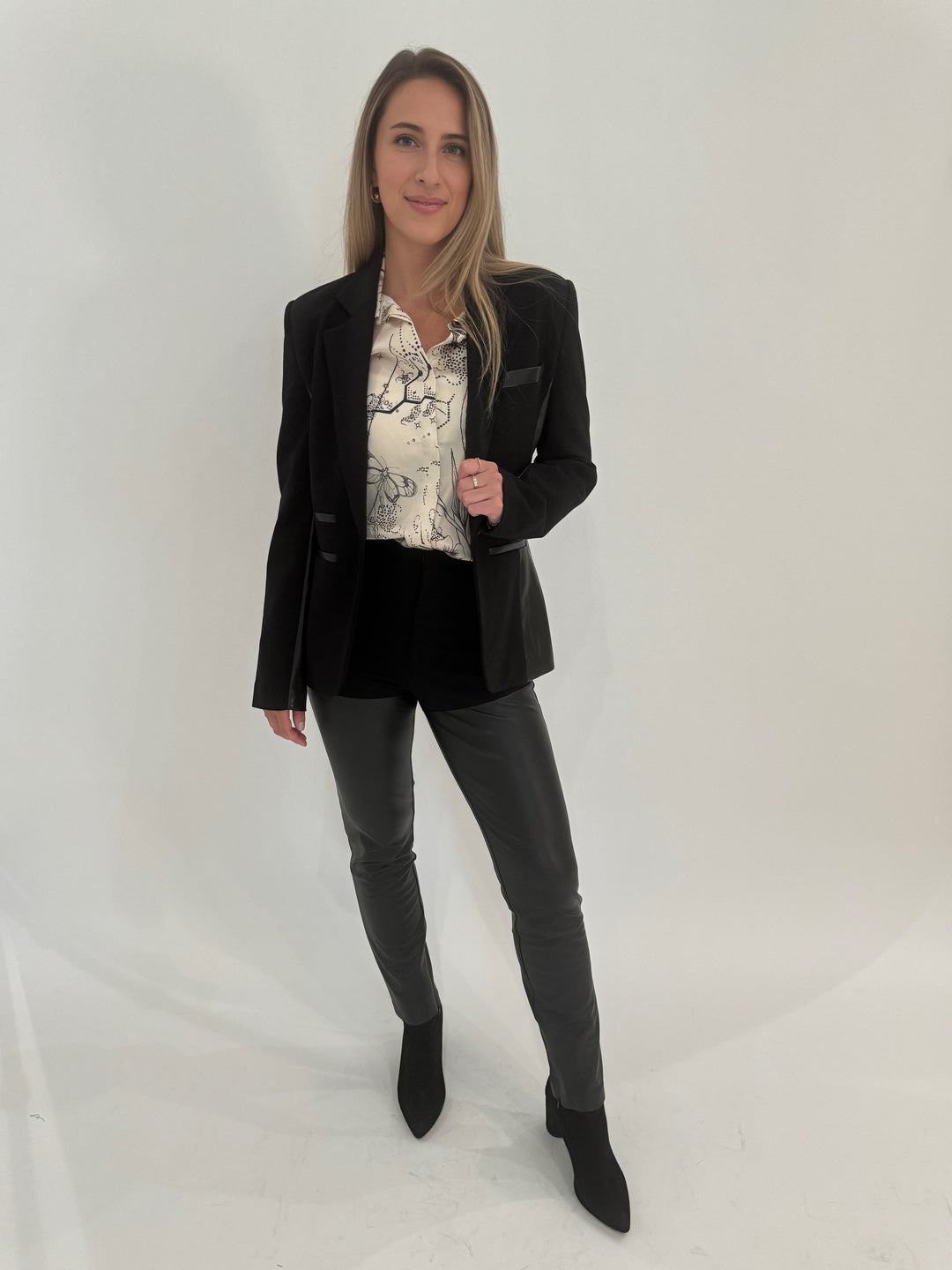 Generation Love Gayle Vegan Leather Ponte Combo Blazer in Black with ME369 Joelle Shirt in Tattoo print underneath, paired with Generation Love Petra Vegan Leather Ponte Combo Pants, all available at Barbara Katz