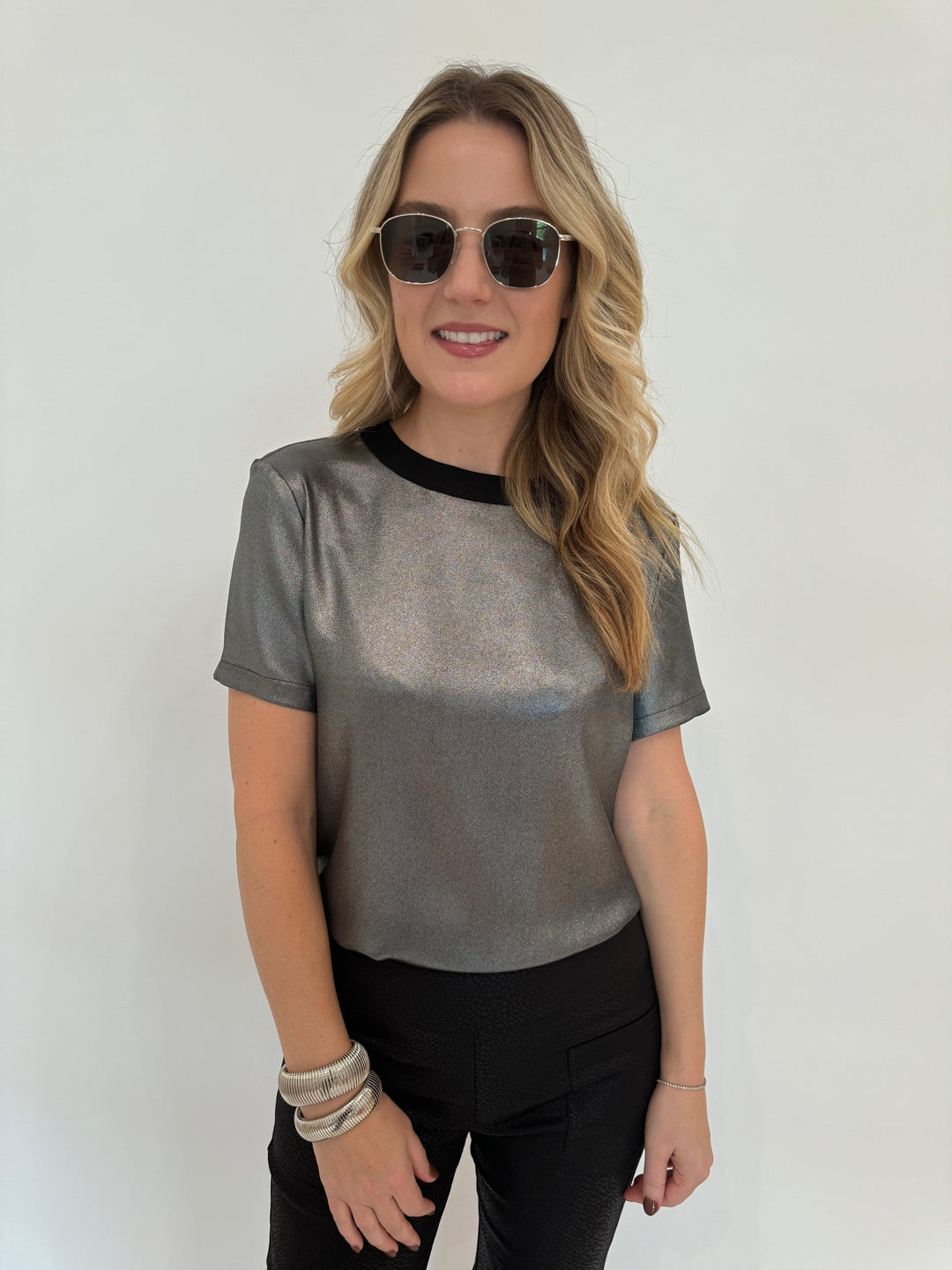 Elliott Lauren Slinky Metallic Tee in Silver paired with Black Lava Pants With Patch Pocket, BK Silver Cobra Cuff and Bracelet, Le Specs Neptune Deux Sunglasses - all available at Barbara Katz