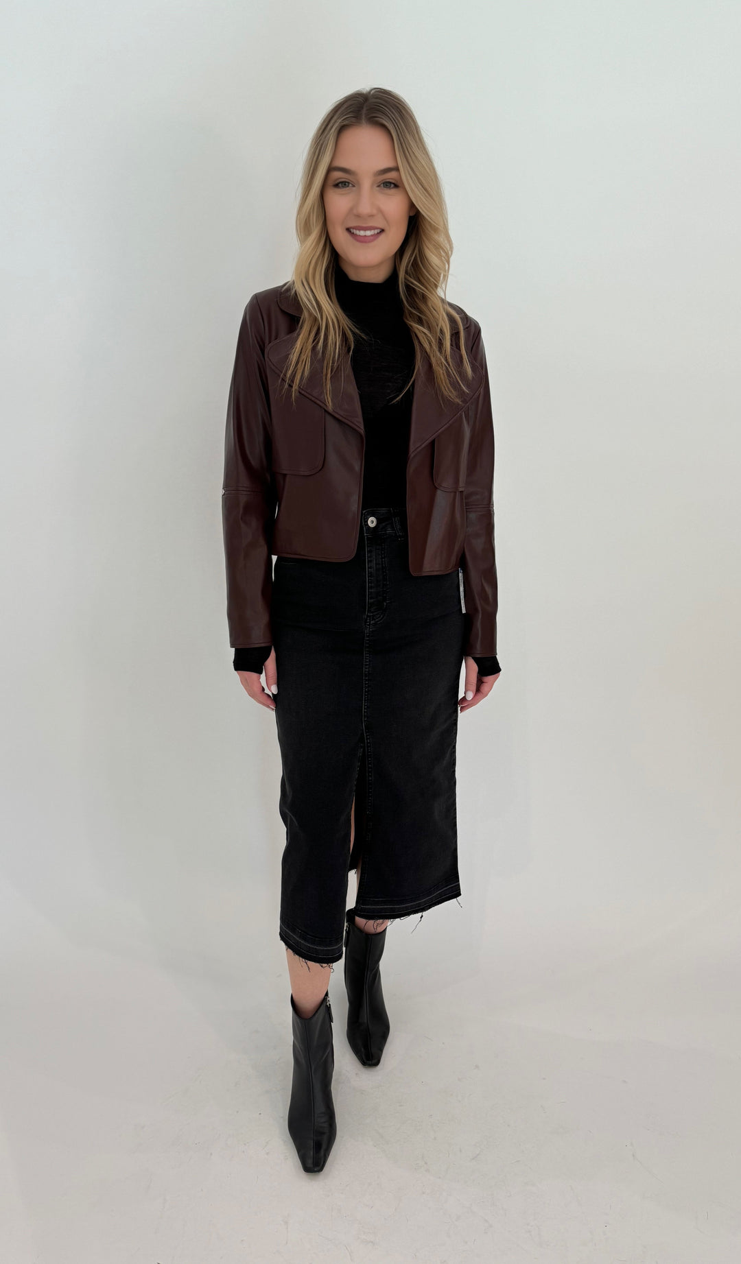 Elliott Lauren Geneva Jean Skirt With Front Slit in Black paired with Adroit Atelier Ninon Vegan Leather Jacket in Chocolate available at Barbara Katz