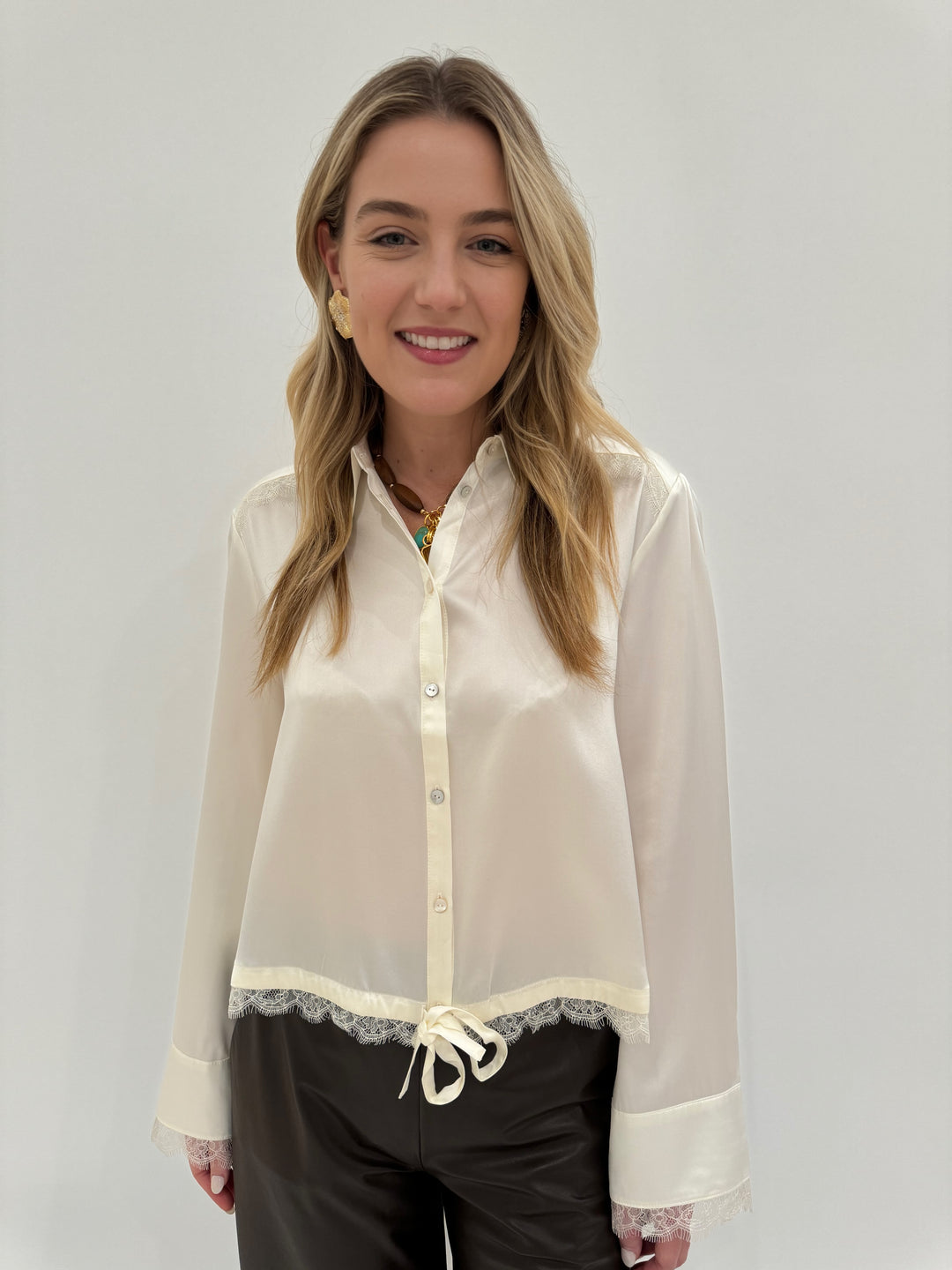 Cinq a Sept Mabyn Silk Top in Ivory paired with Max Mara Struzzo Vegan Leather Pants in Hazelnut available at Barbara Katz