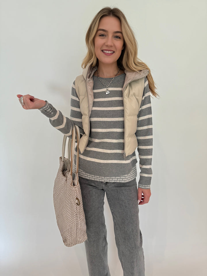 Adroit Atelier Lola Quilted Full Zip Vest in Oak with Oui Striped Sweater underneath, paired with MAC Dream Wide Jeans Metallic, Milio Milano Intrecciato Braided Tote Bag in Beige, all available at Barbara Katz