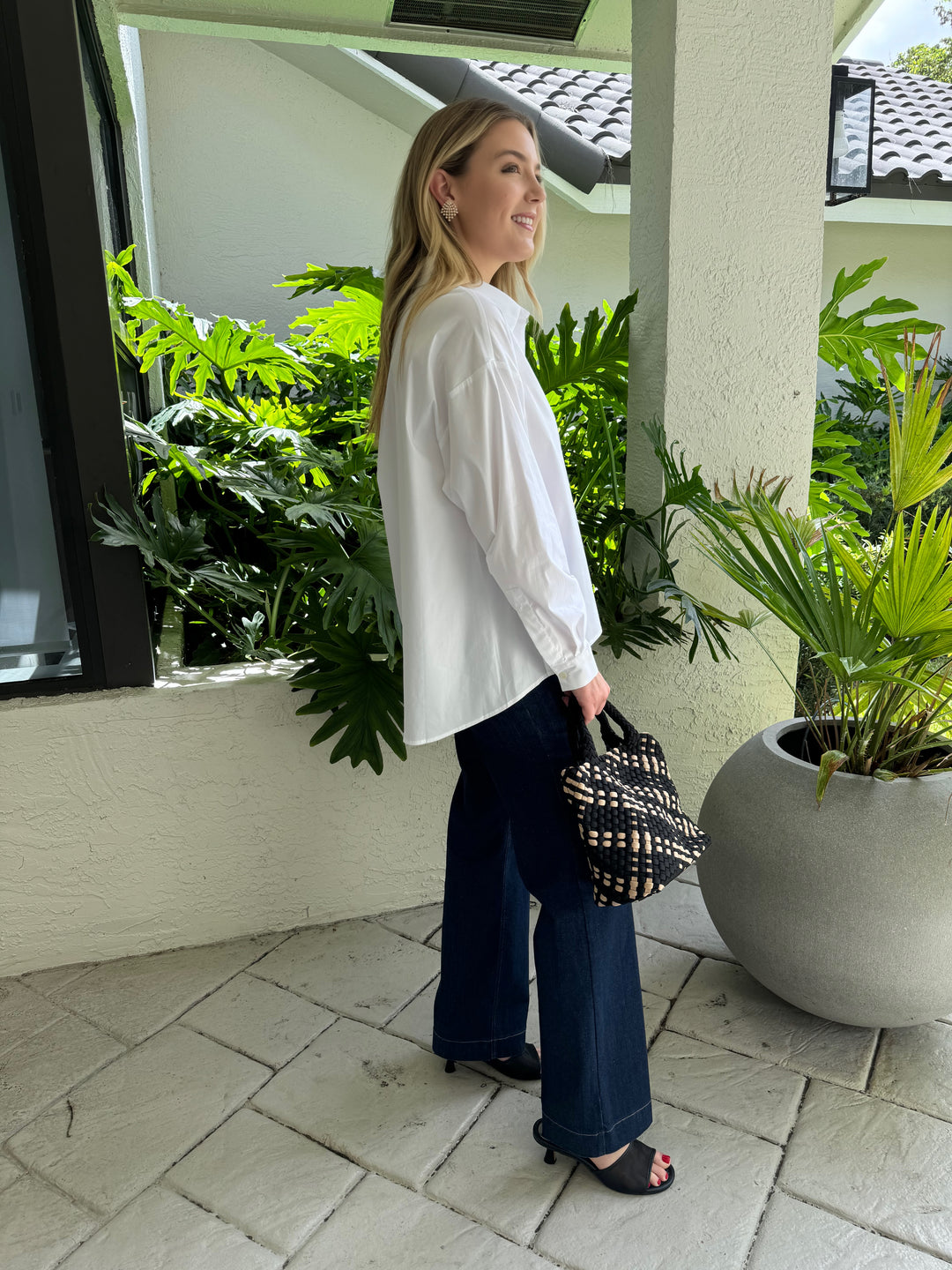 Repeat Blouse With Side End Slits in White paired with MAC Denim Dream Wide Jeans 32" in Indigo Dark, and Sol and Selene Sky's The Limit Small Tote Bag in Black/Nude