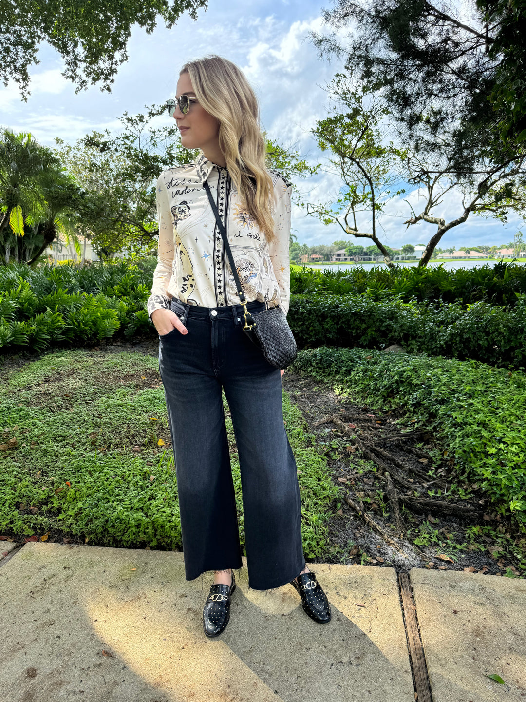 Oui Leopard Silky Shirt Blouse paired with Citizens of Humanity Lyra Crop Wide Leg Denim Jeans in Medallion, Le Specs Neptune Deux Sunglasses, Clare V Petit Moyen Messenger Bag in Black Woven Checker - all available at Barbara Katz