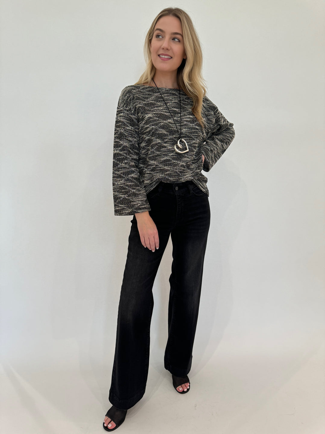 MAC Denim Dream Wide Jeans 32" in Black Used paired with BK Katy Textured Long Sleeve Lounge Top in Black/Cream, accessory Paula Rosen Jewelry Big Heart Silver With Leather Cord Necklace, all available at Barbara Katz