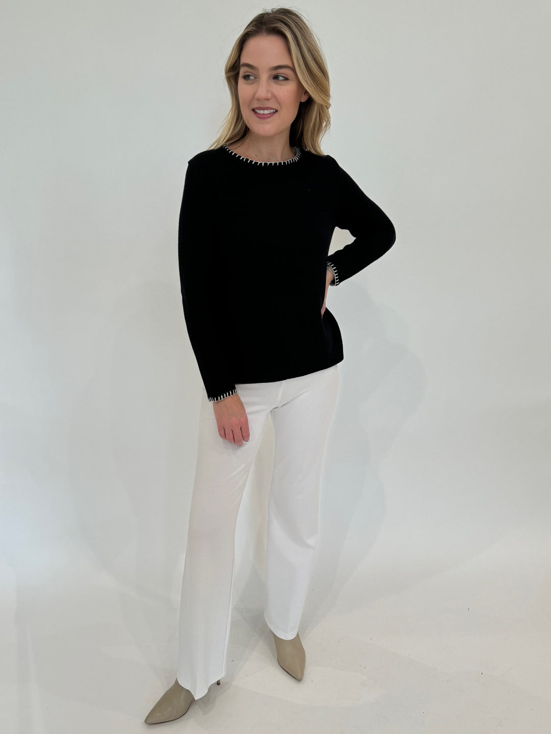 Elliott Lauren Whipstitch Crew Neck Sweater in Black paired with White Pants available at Barbara Katz