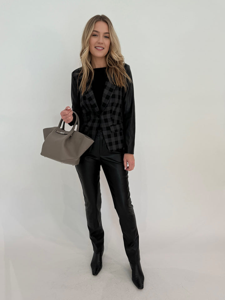 Peace of Cloth Rowan Moto Jacket in Grey/Black with Aldomartins Black Norin Top underneath, paired with Peace of Cloth Faux Leather Slim Jeans, bag DeMellier The Midi New York Tote in Stone Grey, all available at Barbara Katz