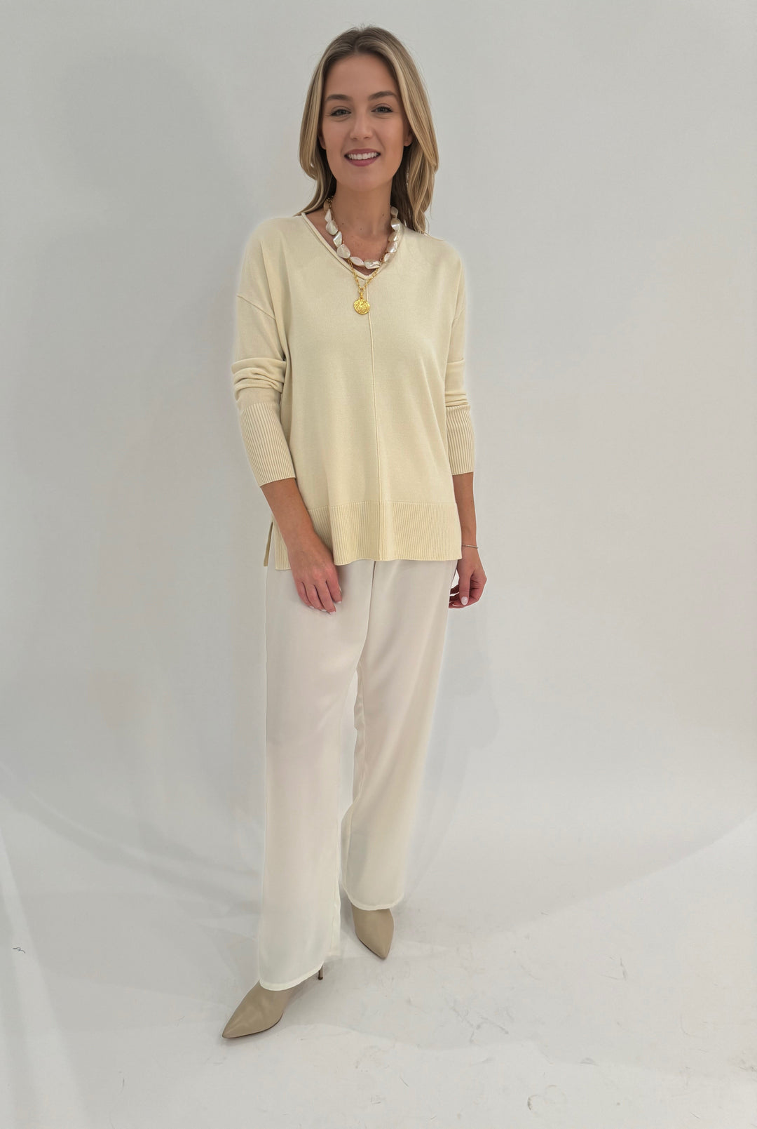 BK Selena Roll V-Neck Long Sleeve Sweater in Ivory paired with Raffaello Rossi Palina 6/8 Pants in Wool White available at Barbara Katz