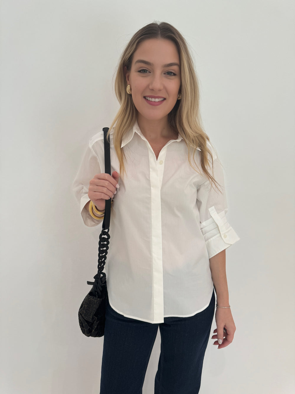 Simkhai Gemma Three-Quarter Sleeve Shirt in White with Daniella Lehavi Tokyo Bali Bag and Barbara Katz Jewelry