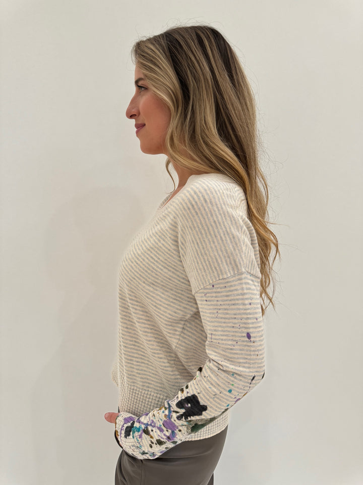 Lisa Todd Between The Lines Paint Splatter V-Neck Long Sleeve Sweater in Sheepskin/Platinum available at Barbara Katz