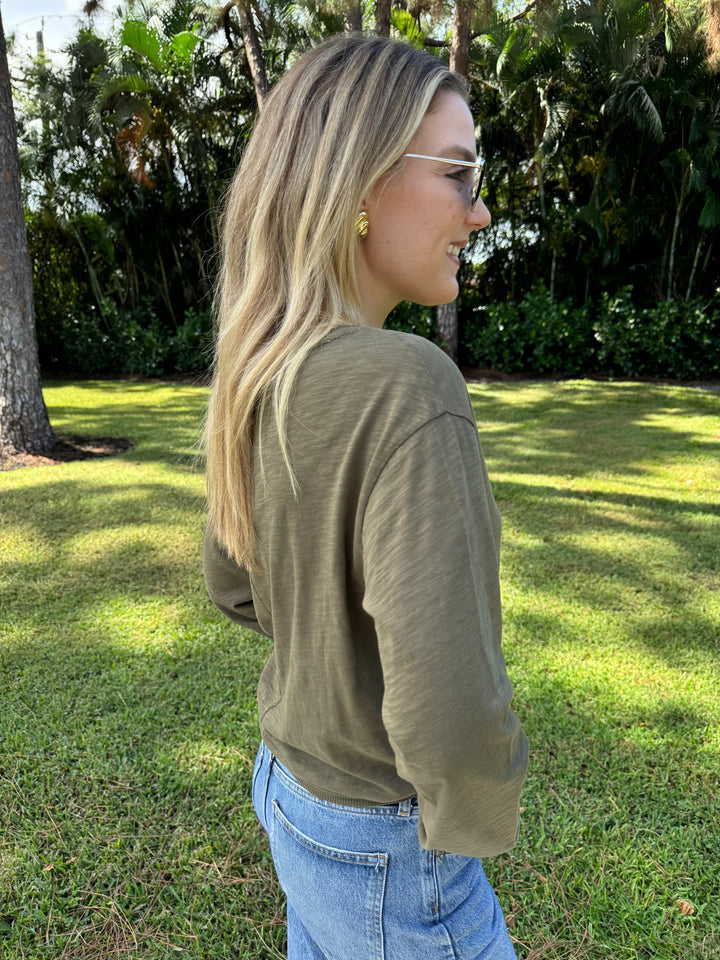 An olive green Elliott Lauren Balloon Sleeve Tee made of 100% cotton, with long sleeves, round neck, and ribbed trims. Perfect for casual wear. #elliottlauren #longsleeves #tee