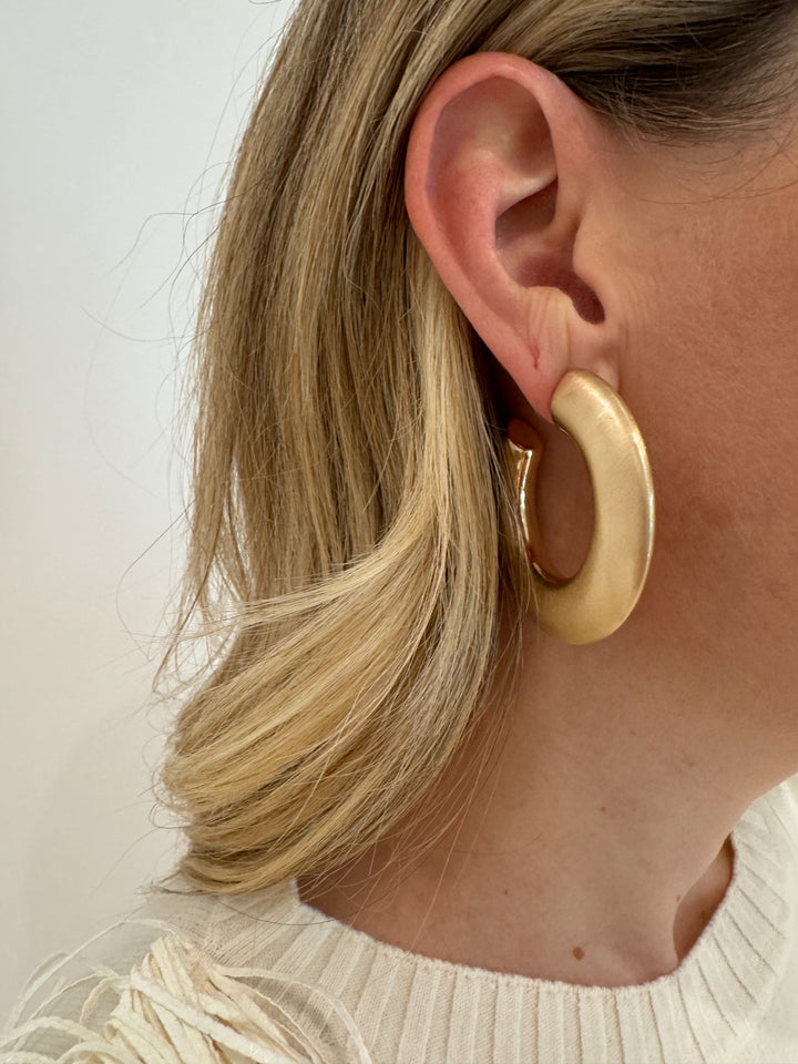 BK Jewelry Martha Chunky Metal Tube Hoop Earrings in Satin Gold available at Barbara Katz