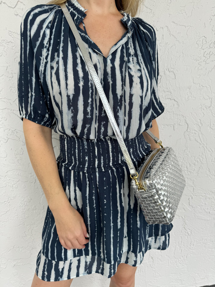 Clare V Midi Sac Crossbody Bag in Silver Woven, Rails Addison Pull-on Skirt paired with Laila Top in Indigo Nile