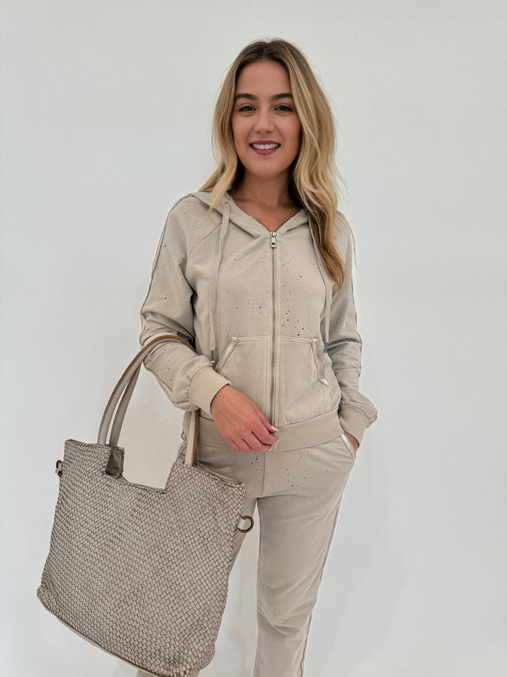 BK Beige Sandy Distressed Zip Hoodie paired with Beige Mandy Distressed Jogger and Beige Intrecciato Tote Bag, all available at barbarakatzshop.com