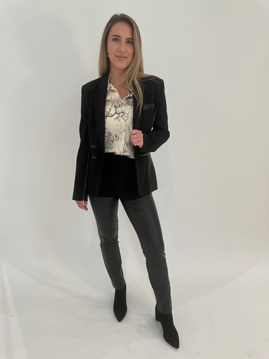 Generation Love Gayle Vegan Leather Ponte Combo Blazer in Black with ME369 Joelle Shirt in Tattoo print underneath, paired with Generation Love Petra Vegan Leather Ponte Combo Pants, all available at Barbara Katz