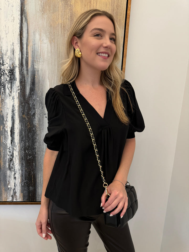 Cinq a Sept Weldon V-Neck Top in Black with Mignonne Gavigan Christopher Stud Earrings in Gold and BK Square Weave Leather Bag in Black - all available at Barbara Katz