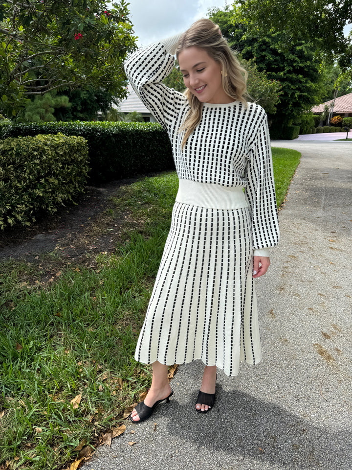 Maria Pavan White/ Black Aurora Balloon Long Sleeve Top paired with matching Midi Skirt available at Barbara Katz