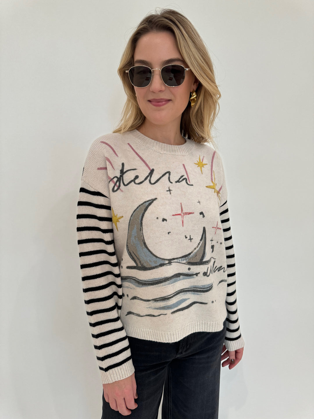 Oui Stella Luna Pullover Sweater paired with Le Specs Neptune Deux Sunglasses, and Alexis Bittar Gold Crumpled Small Post Earrings  - all available at Barbara Katz