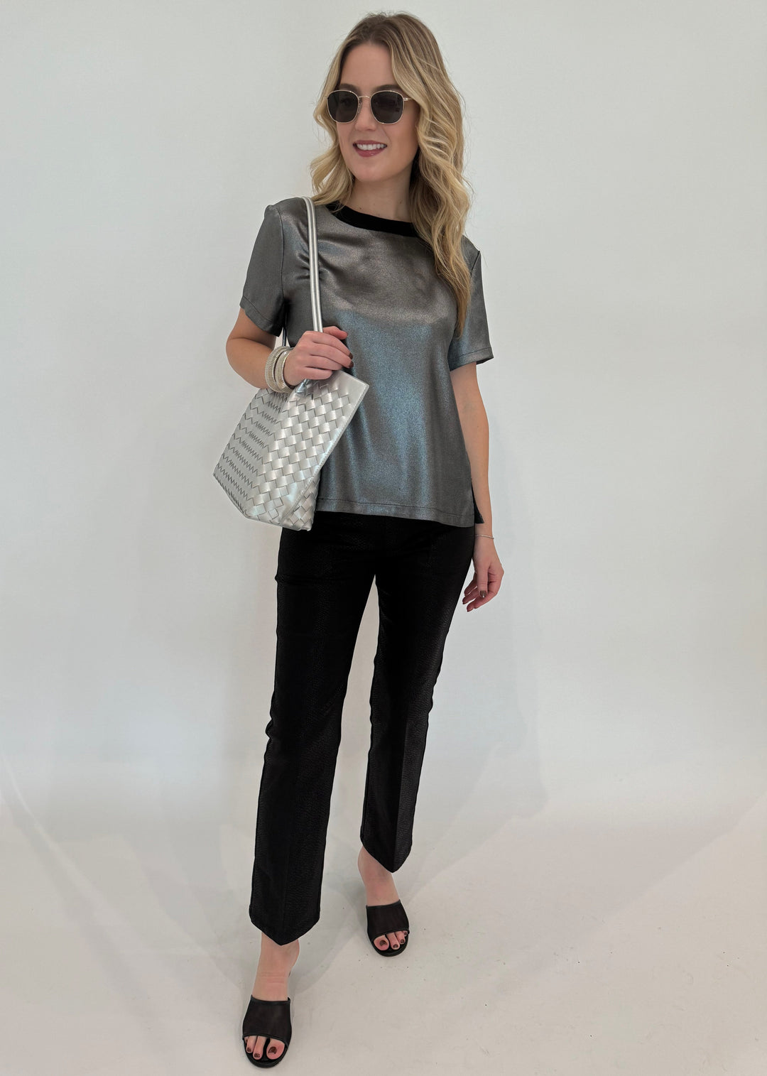 Elliott Lauren Slinky Metallic Tee in Silver paired with Black Lava Pants With Patch Pocket, BK Silver Victoria Medium Tote Bag, BK Silver Cobra Cuff and Bracelet, Le Specs Neptune Deux Sunglasses - all available at Barbara Katz