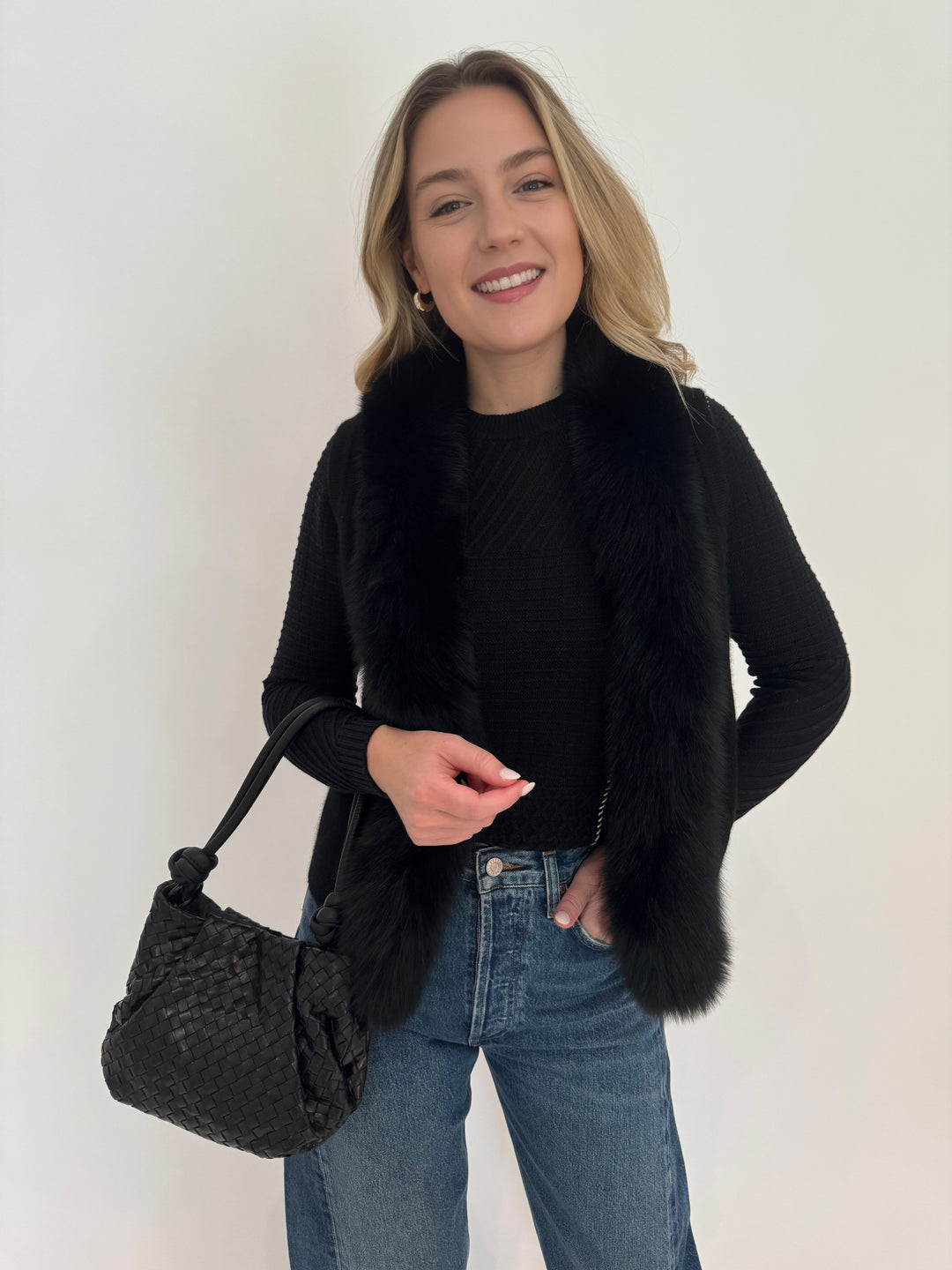 Barbara Katz Diana Patchwork Sweater in Black with Mona Cashmere Fox Trim Vest and Daniela Lehavi Bali Mini Knotted Bag in Black