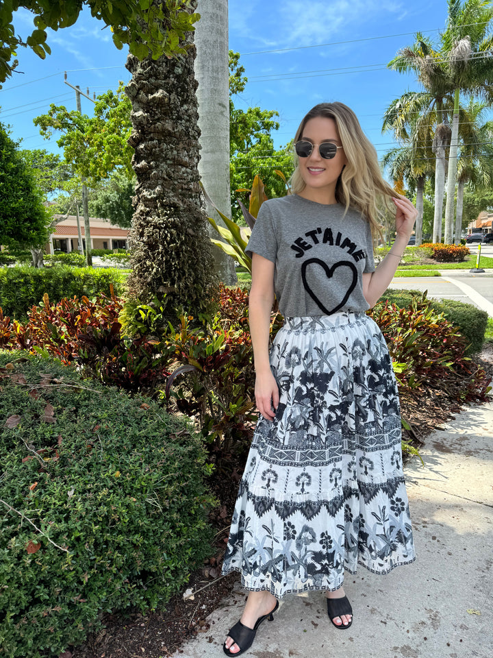 Model wearing Le Specs Neptune Deux Gold Polarized sunnies, Cinq a Sept Je T'Aime Textured Graphic Tee in Grey, an Dizzy-Lizzie Woodstock Pull-on Midi Skirt in Grey Ikat Print