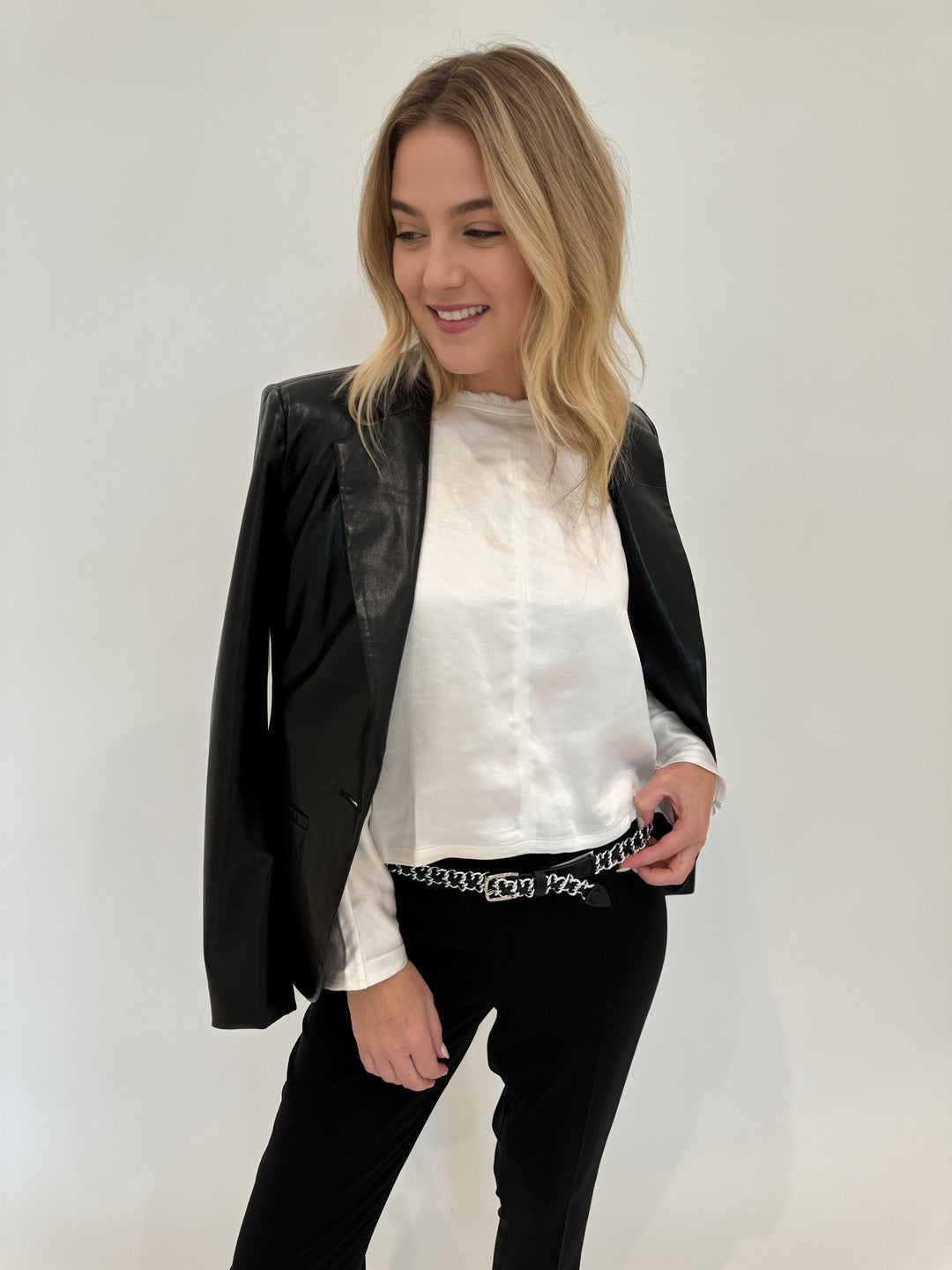 Melissa Nepton Tenesi Satin Top in Off White layered with Adroit Atelier Black Ninon Vegan Leather Jacket available at Barbara Katz