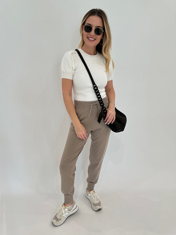 Max Mara Leisure Pila Sweatpants in Turtledove paired with Marella Anfora Short-Sleeve Sweater in White, Daniella Lehavi Tokyo Bali Bag in Black, Le Specs Neptune Sunglasses