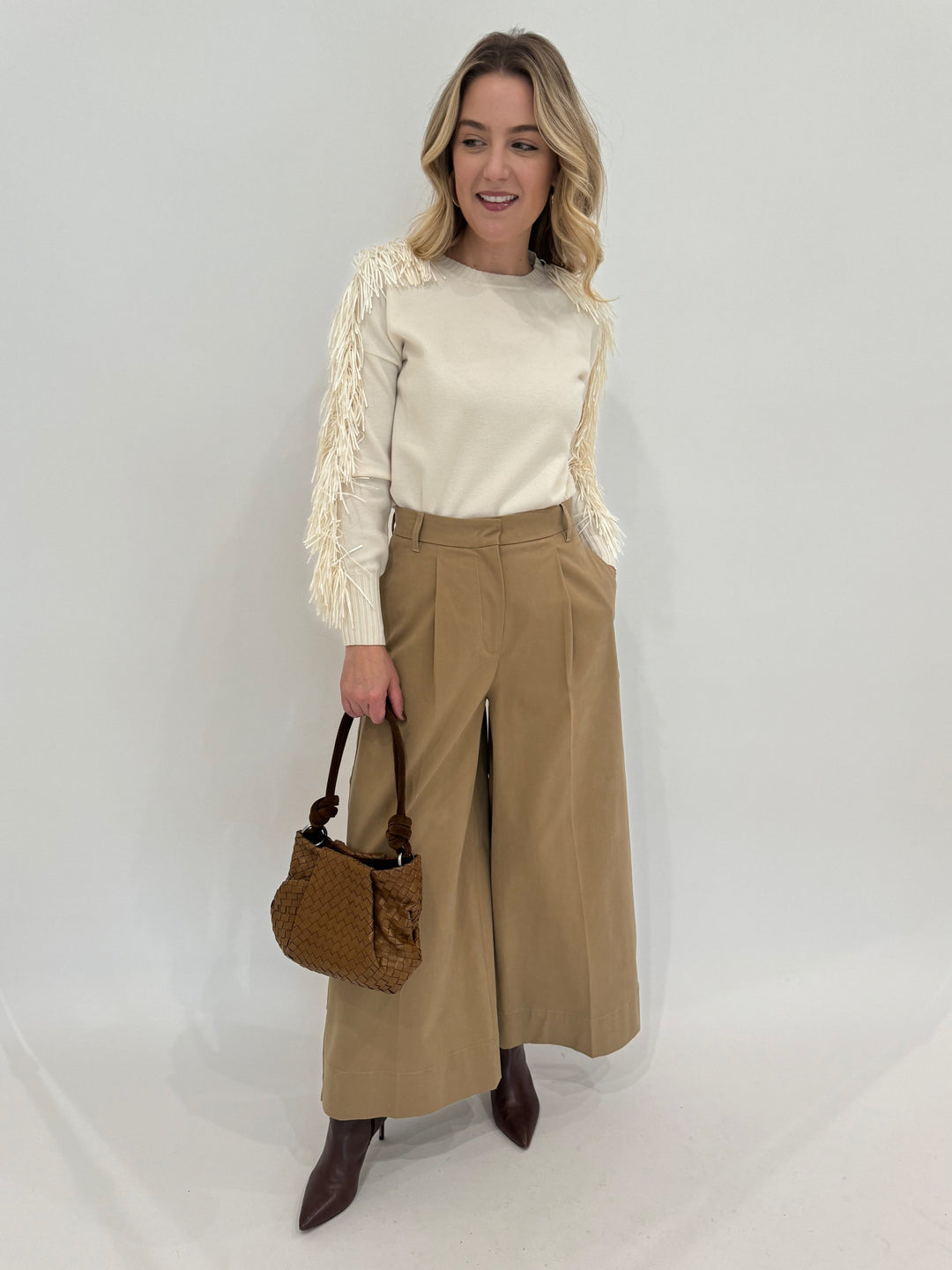 D.Exterior Fringe Sleeve Crew Sweater in Latte paired with Max Mara Weekend Caprile Button Side Pants in Beige and Daniella Lehavi Caramel Woven Bali Knotted Bag - all available at Barbara Katz