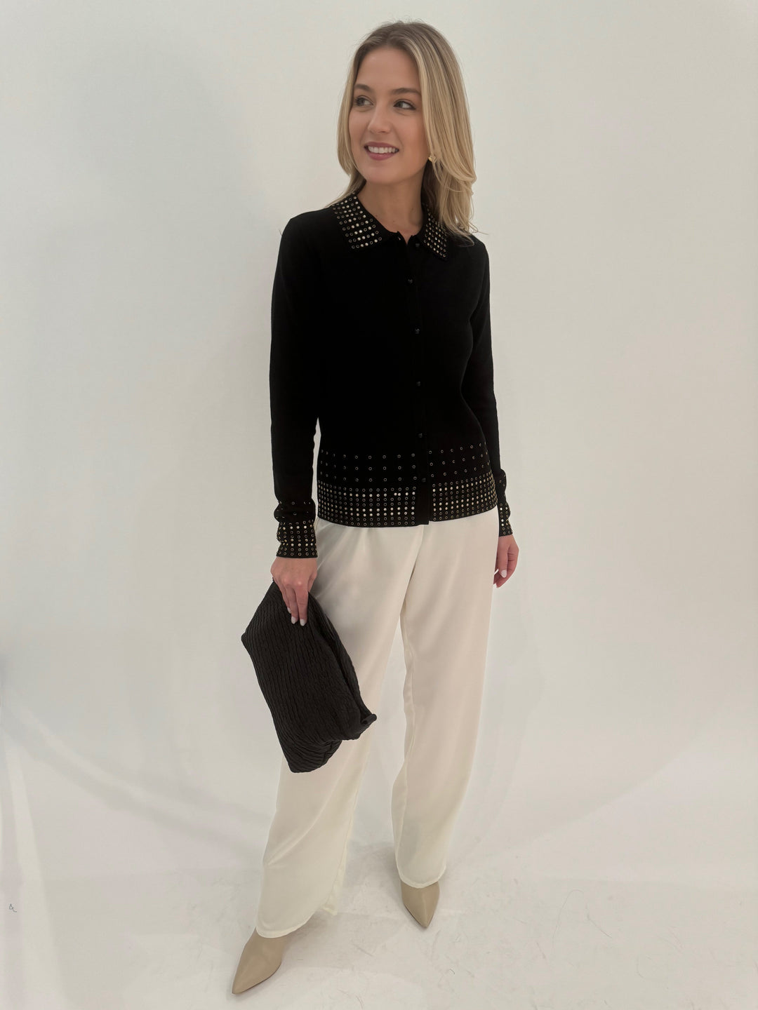 Leo & Ugo Rhinestone Grommet Cardigan in Black paired with White Pants available at Barbara Katz