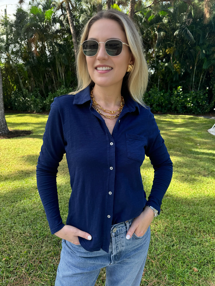 A midnight blue Elliott Lauren Button Front Shirt made of 100% cotton, with long sleeves, a button-down front, chest pocket, and a collar. Ideal for formal or casual wear. #elliottlauren #shirt #longsleeves