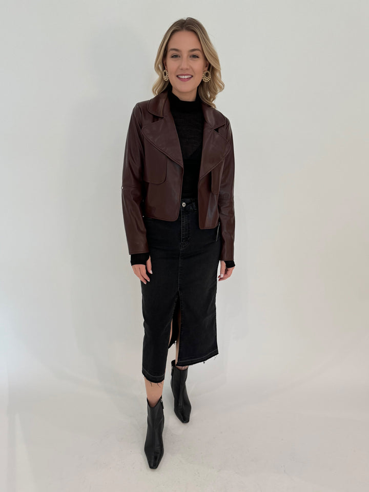 Adroit Atelier Ninon Vegan Leather Jacket in Chocolate with Aldomartins Black Norin Top underneath, paired with Elliott Lauren Geneva Jean Midi Skirt available at Barbara Katz