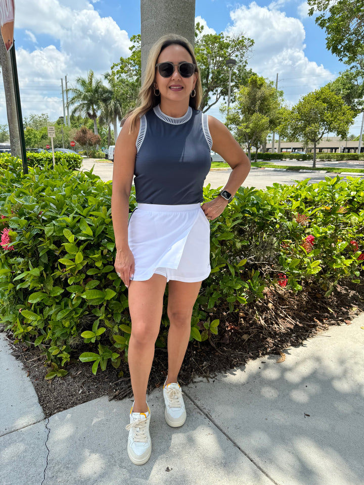 Varley Boston Mid-Rise Skort 13.5" in White, pull-on style mini skort with mid-rise fit, wrap front design, and inner shorts with pocket #tennisskirt