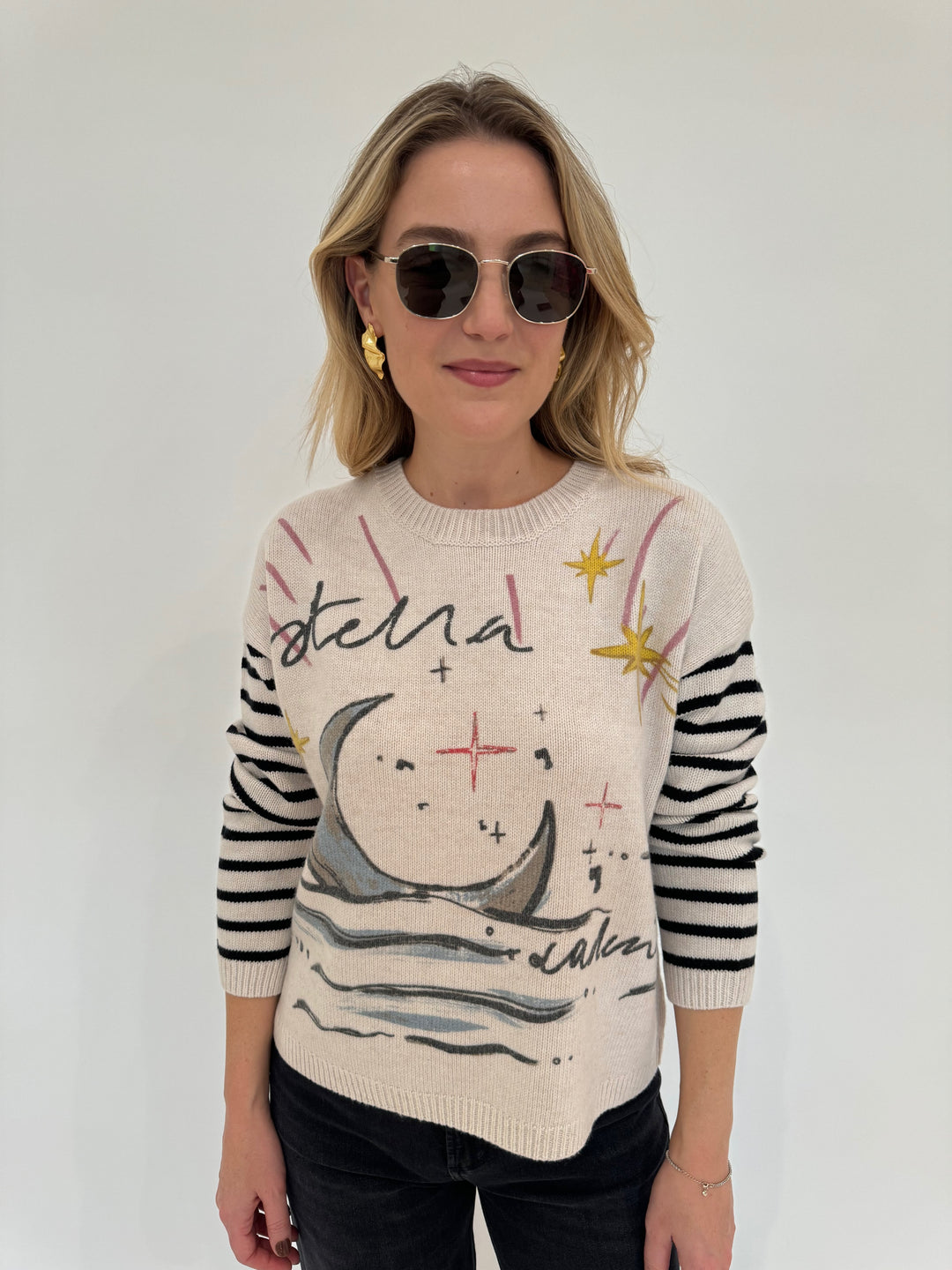 Oui Stella Luna Pullover Sweater paired with Le Specs Neptune Deux Sunglasses, and Alexis Bittar Gold Crumpled Small Post Earrings  - all available at Barbara Katz