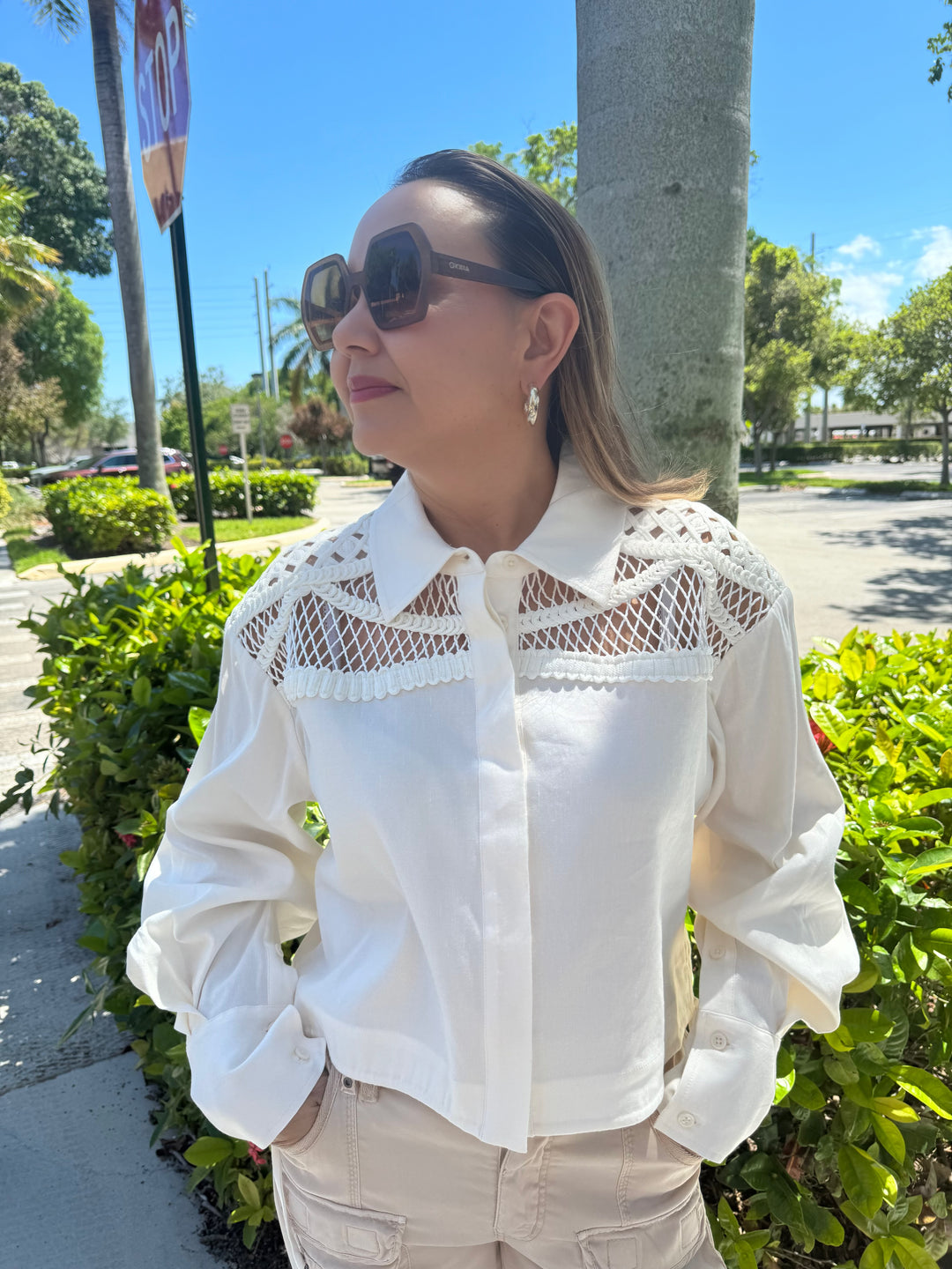 Simkhai Braxton Long Sleeve Drawstring Shirt in White, collared shirt with button front, long sleeves, net shoulder detail, drawstring waist, and slightly cropped length