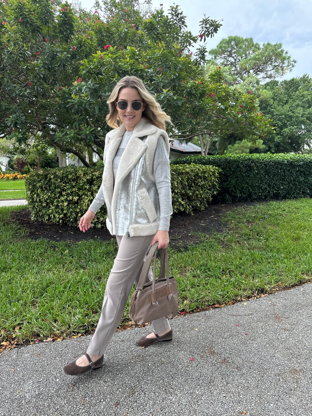 D.Exterior Multi Stripe Crew Sweater in Cenere layered with Metallic Vest in Onice, paired with EW Straight Leg Trouser in Visone, Daniella Lehavi Eveline Satchel Bag in Mocca Stripes, Le Specs Neptune Deux Sunglasses - all available at Barbara Katz