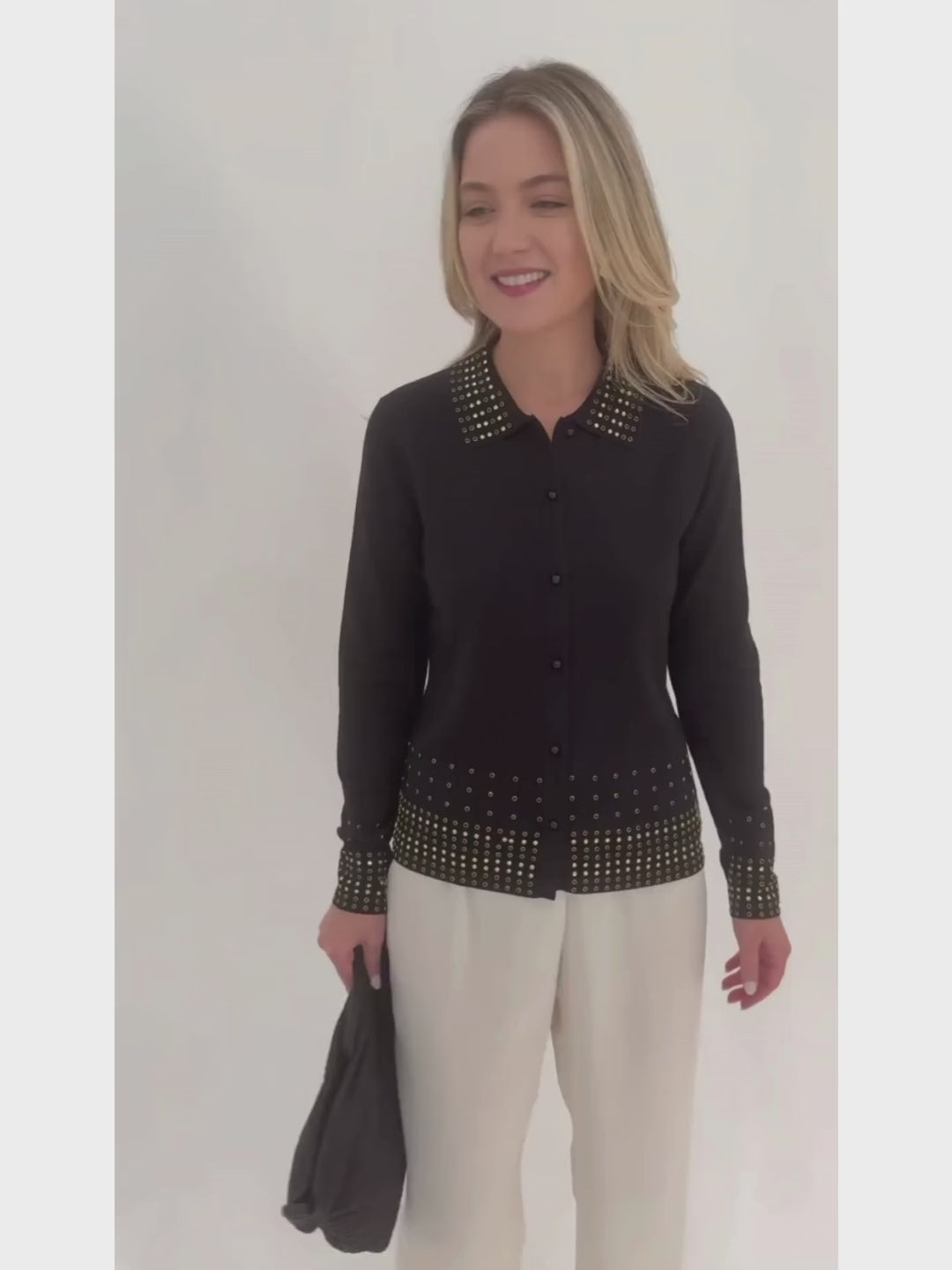 Leo & Ugo Rhinestone Grommet Cardigan in Black paired with White Pants available at Barbara Katz